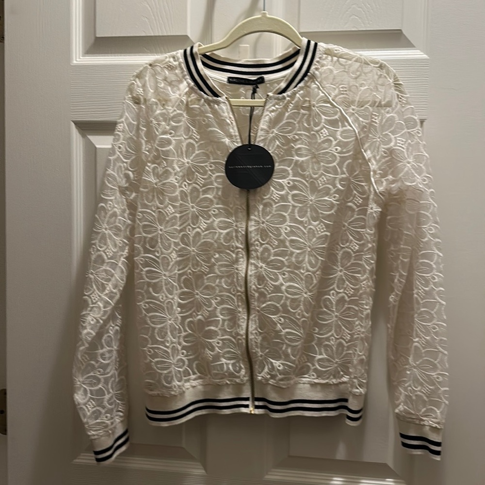 Super cute lace style jacket! Never been worn.